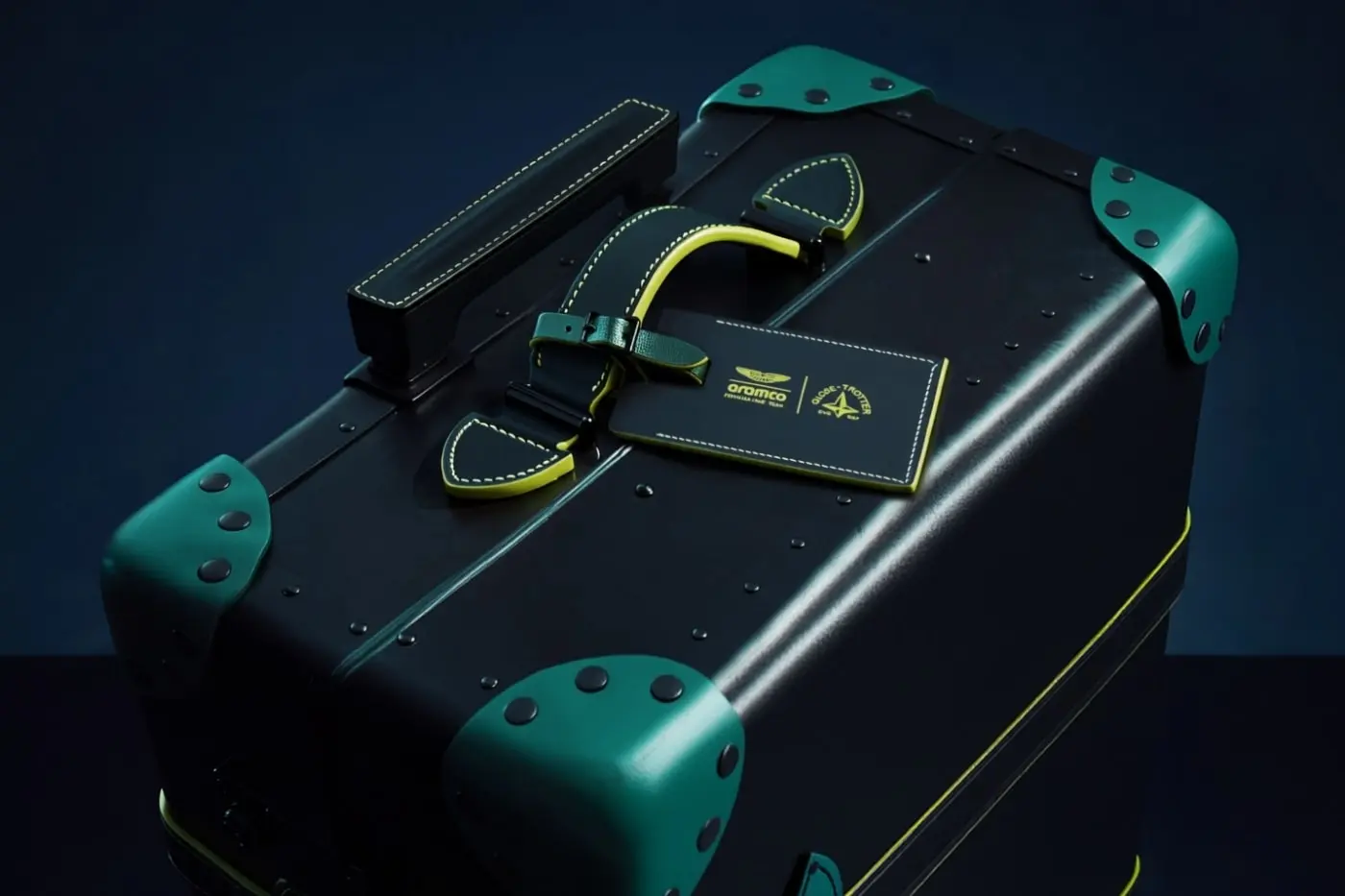 Detail view of Globe-Trotter Aston Martin Green accent hardware and branding