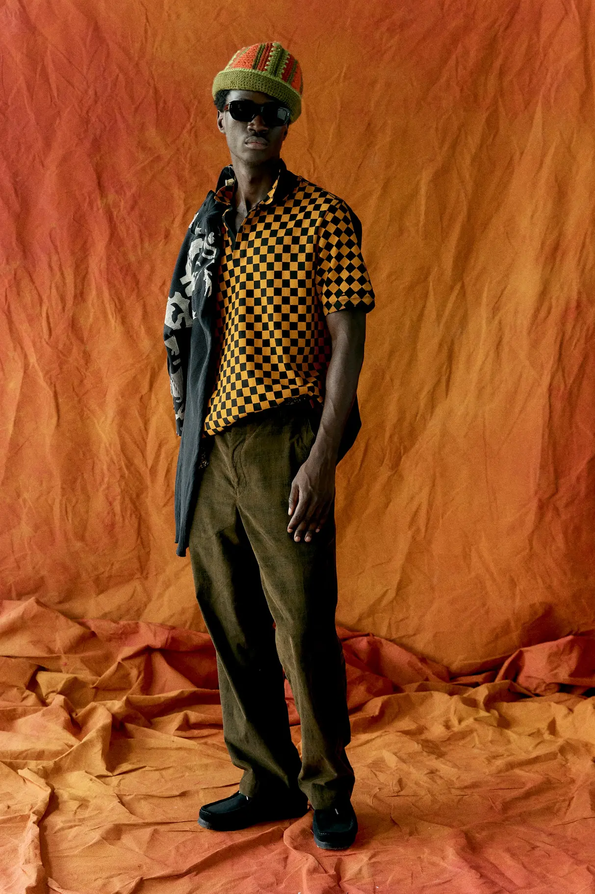 Nicholas Daley SS27 oversized rugby shirt in muted earth tones with visible stitching detail