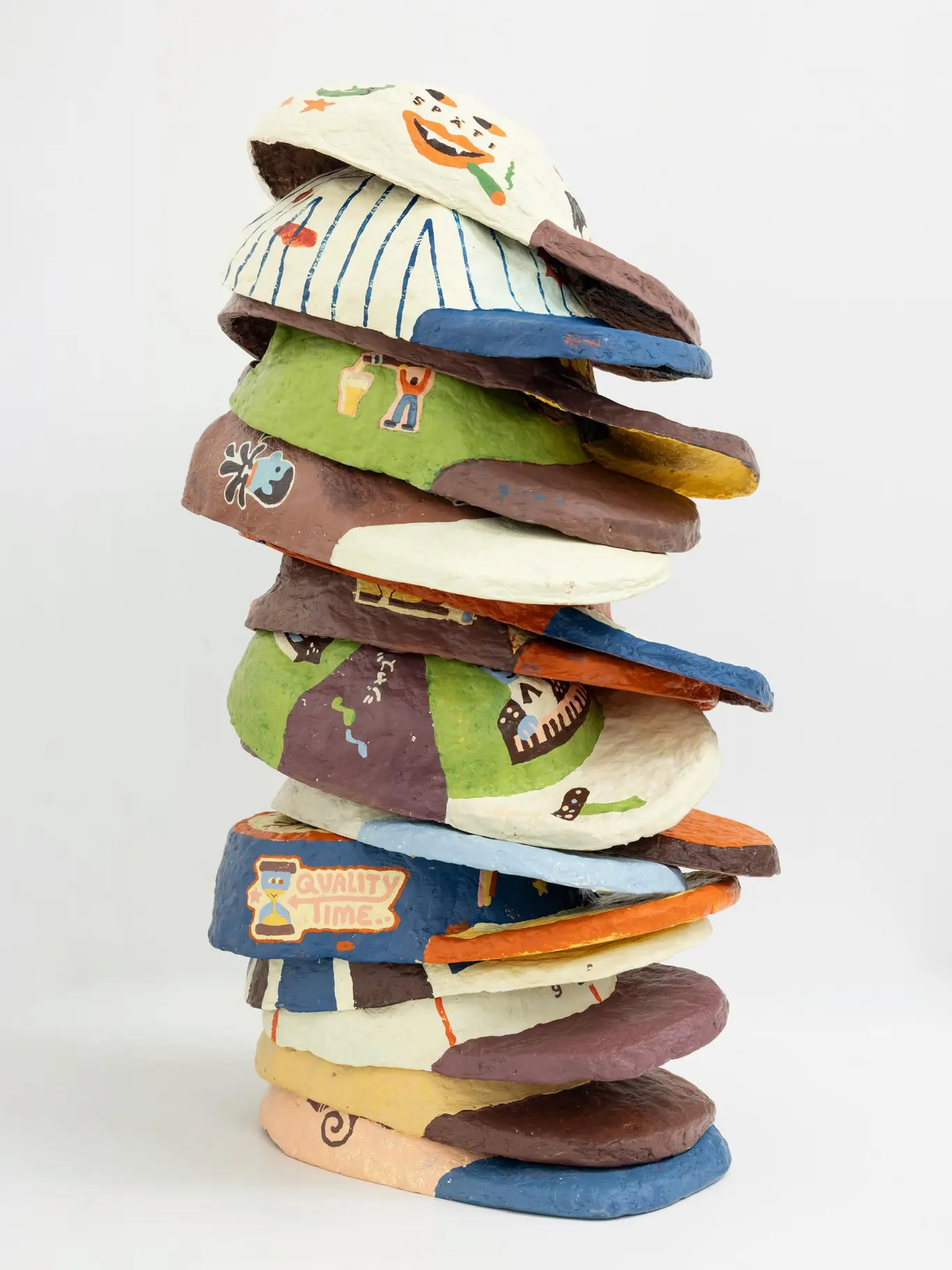 Papier-mache skate cap painted with an invented team insignia, matte and ridged from drying.