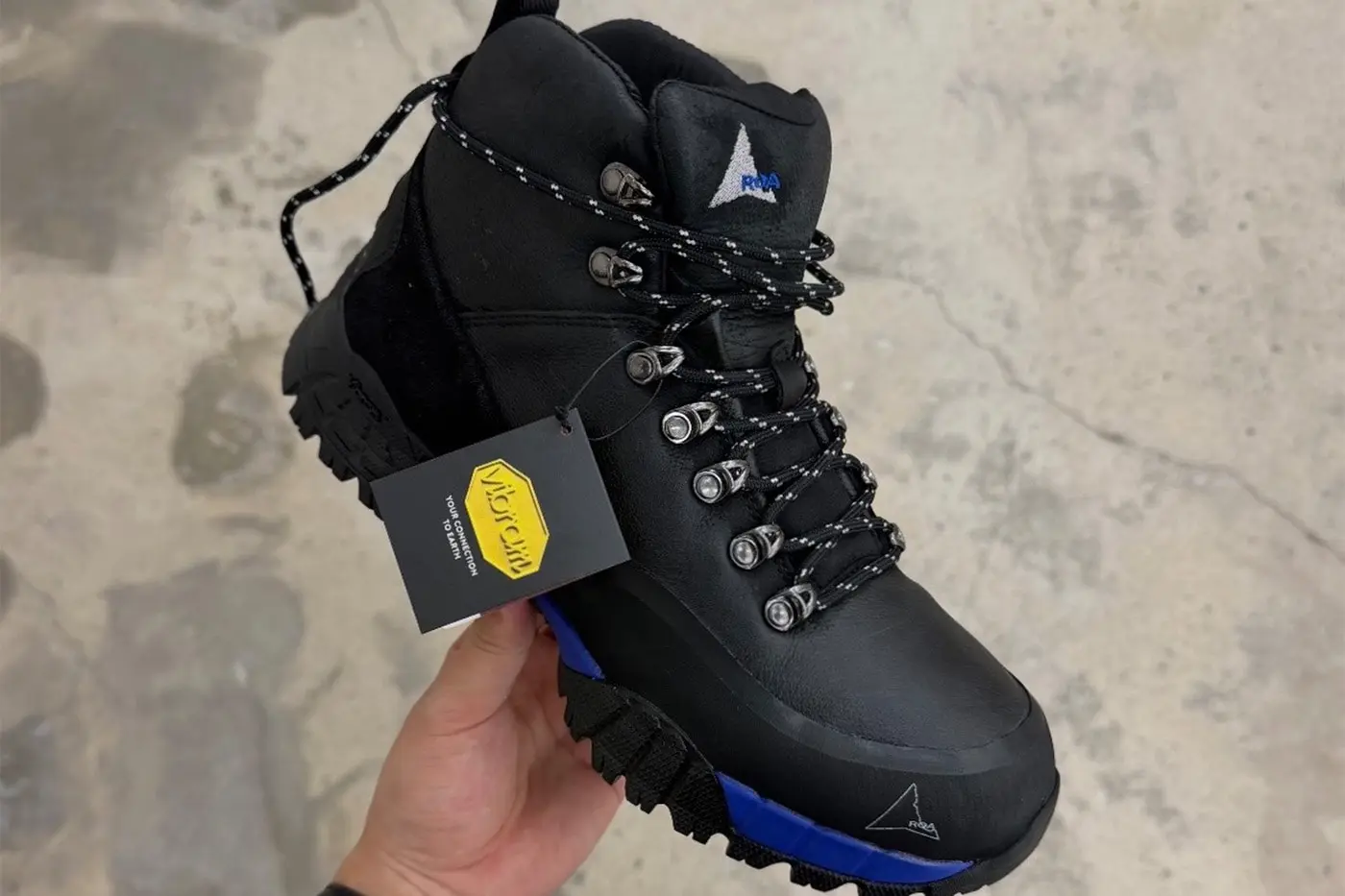 Side profile of the ROA x fragment design Andreas boot showing the technical leather upper